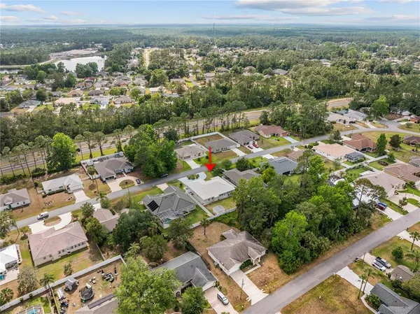 an aerial view of residential house with outdoor space