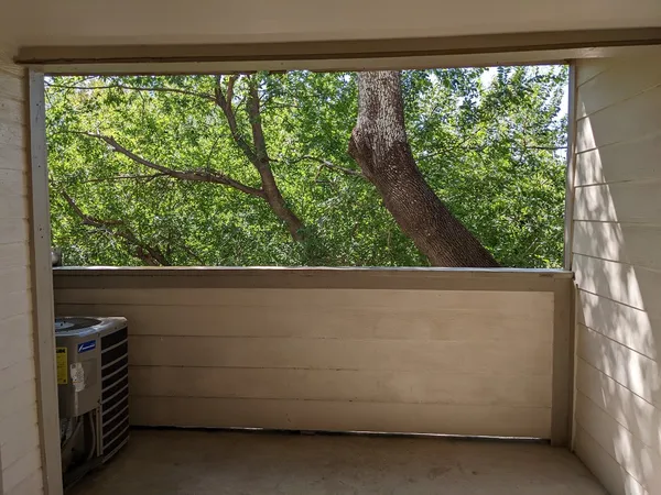 a view of a balcony with an outdoor space