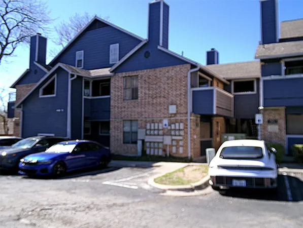 a front view of a house with parking space