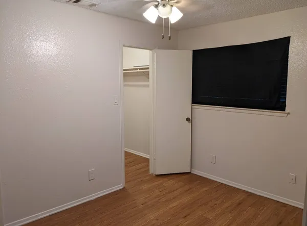 a view of a livingroom with wooden floor