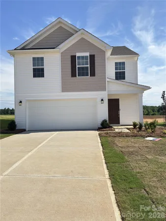 a front view of a house with yard