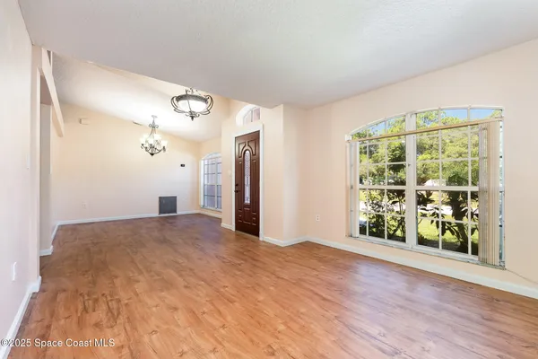 a view of an empty room with a window