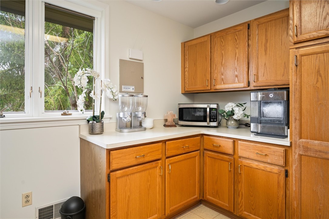 13 Shingle Mill Road Irondequoit, NY 14609 - Photo 23 of 50 Laundry room with counters and cabinets!