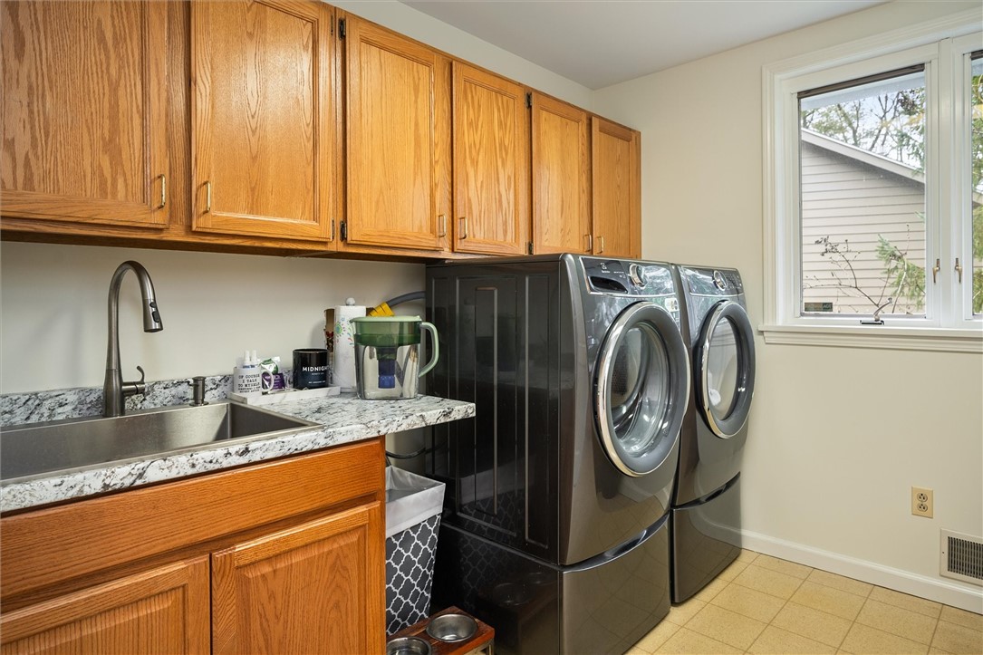 13 Shingle Mill Road Irondequoit, NY 14609 - Photo 24 of 50 Spacious Laundry room - new sink and vanity
