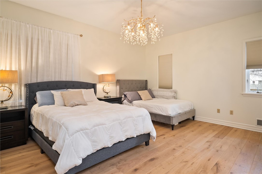 13 Shingle Mill Road Irondequoit, NY 14609 - Photo 25 of 50 Master suite with new flooring and chandelier!