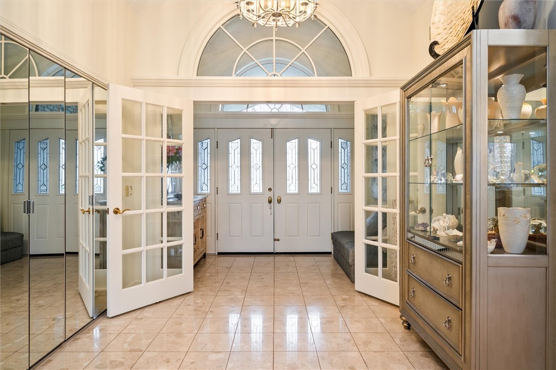 13 Shingle Mill Road Irondequoit, NY 14609 - Photo 5 of 50 Atrium and foyer! Lunette windows and tile floor!