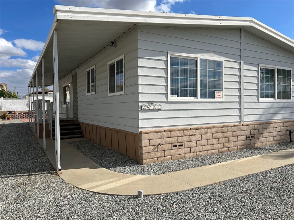 26120 Sultanas Road Homeland, CA 92548 - Photo 1 of 1 a front view of a house with a garage