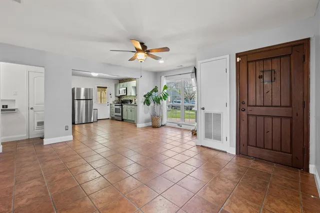 a view of a electric appliances and cabinet in a room