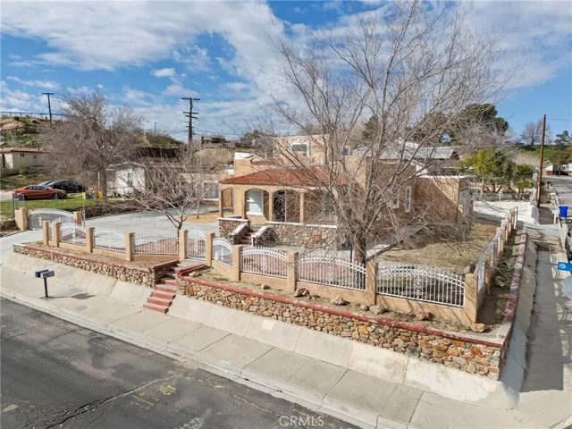 an aerial view of a building with parking
