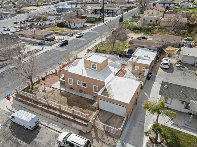 an aerial view of residential houses with parking
