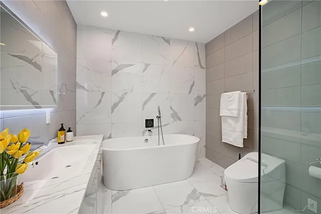 a bathroom with a sink and shower