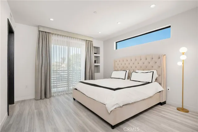 a bathroom with a shower sink and mirror