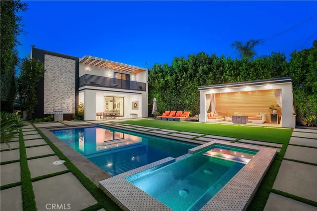 a view of a house with a small yard