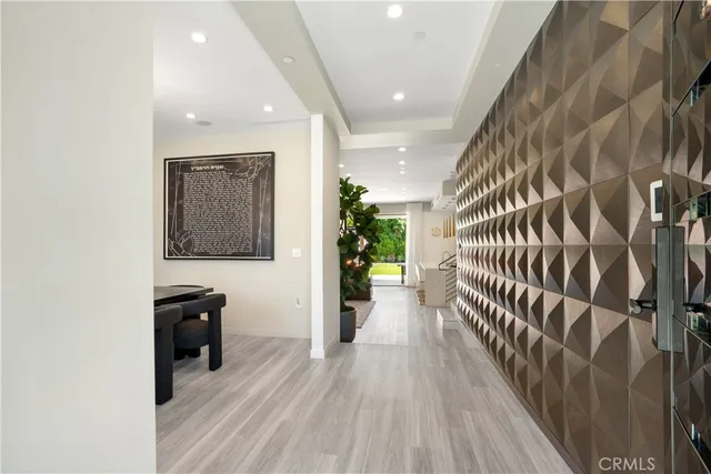 a view of a livingroom with a window and furniture