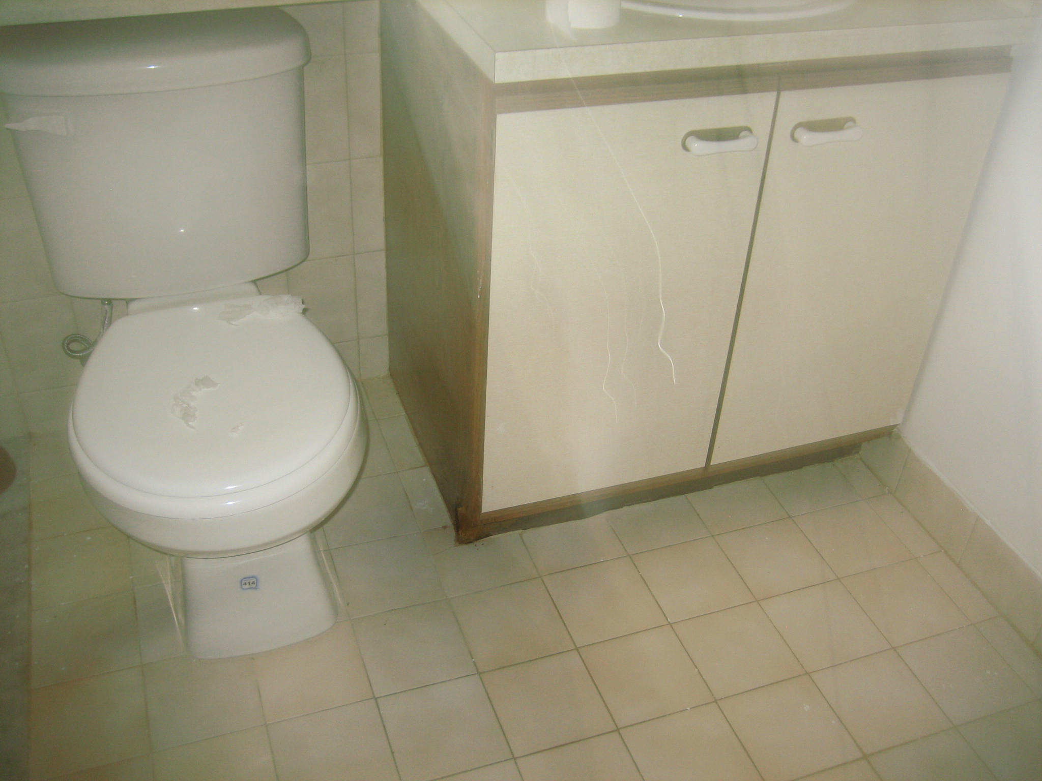 2919 Southeast Amherst Street Stuart, FL 34997 - Photo 7 of 11 Bathroom toilet & tile floor