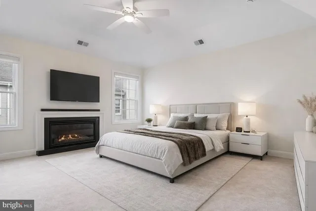 a bedroom with furniture and a flat screen tv