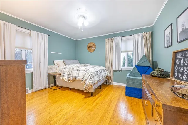 a spacious bedroom with a bed and a table