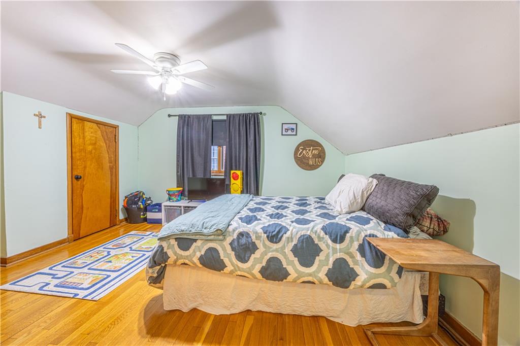 63 Evergreen Terrace Uniontown, PA 15401 - Photo 19 of 25 a bedroom with a bed and a chandelier