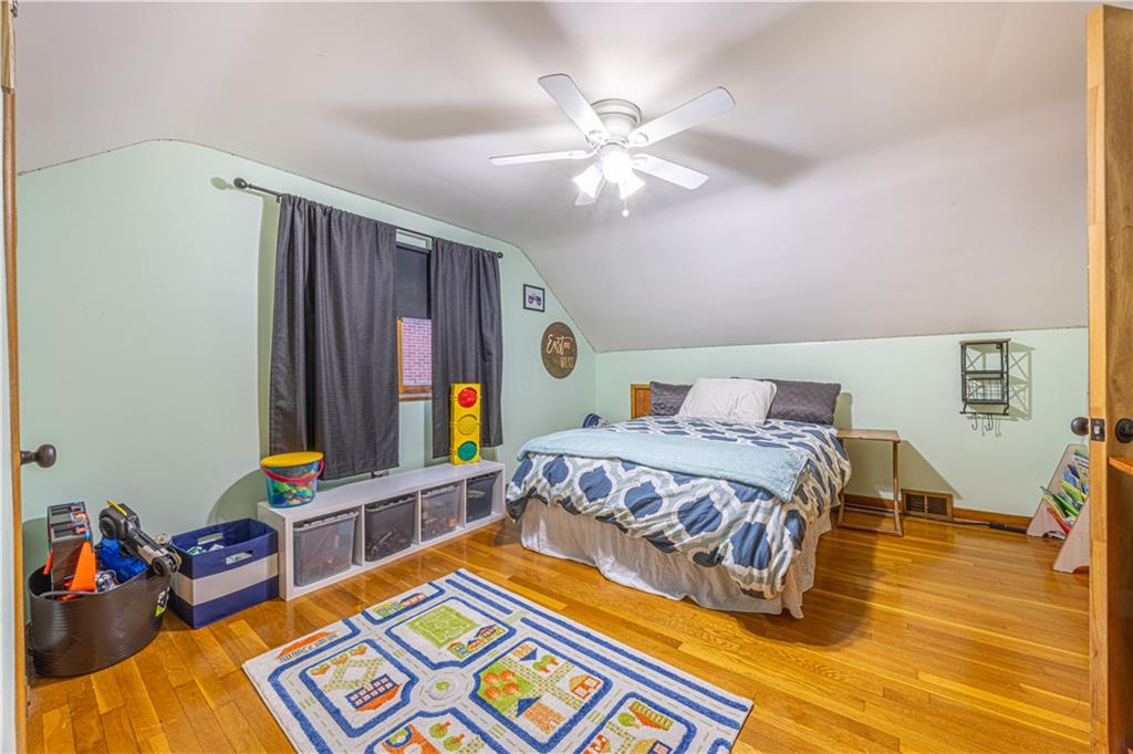 63 Evergreen Terrace Uniontown, PA 15401 - Photo 20 of 25 a bedroom with a bed and wooden floor