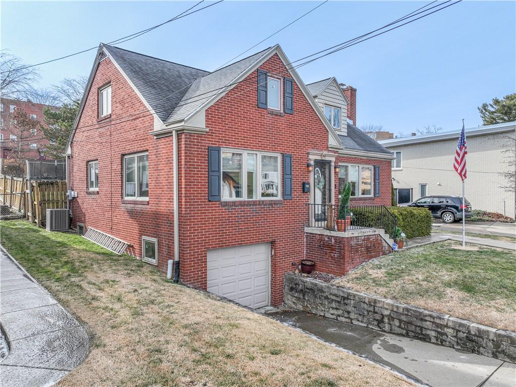 63 Evergreen Terrace Uniontown, PA 15401 - Photo 3 of 25 a front view of a house with garden