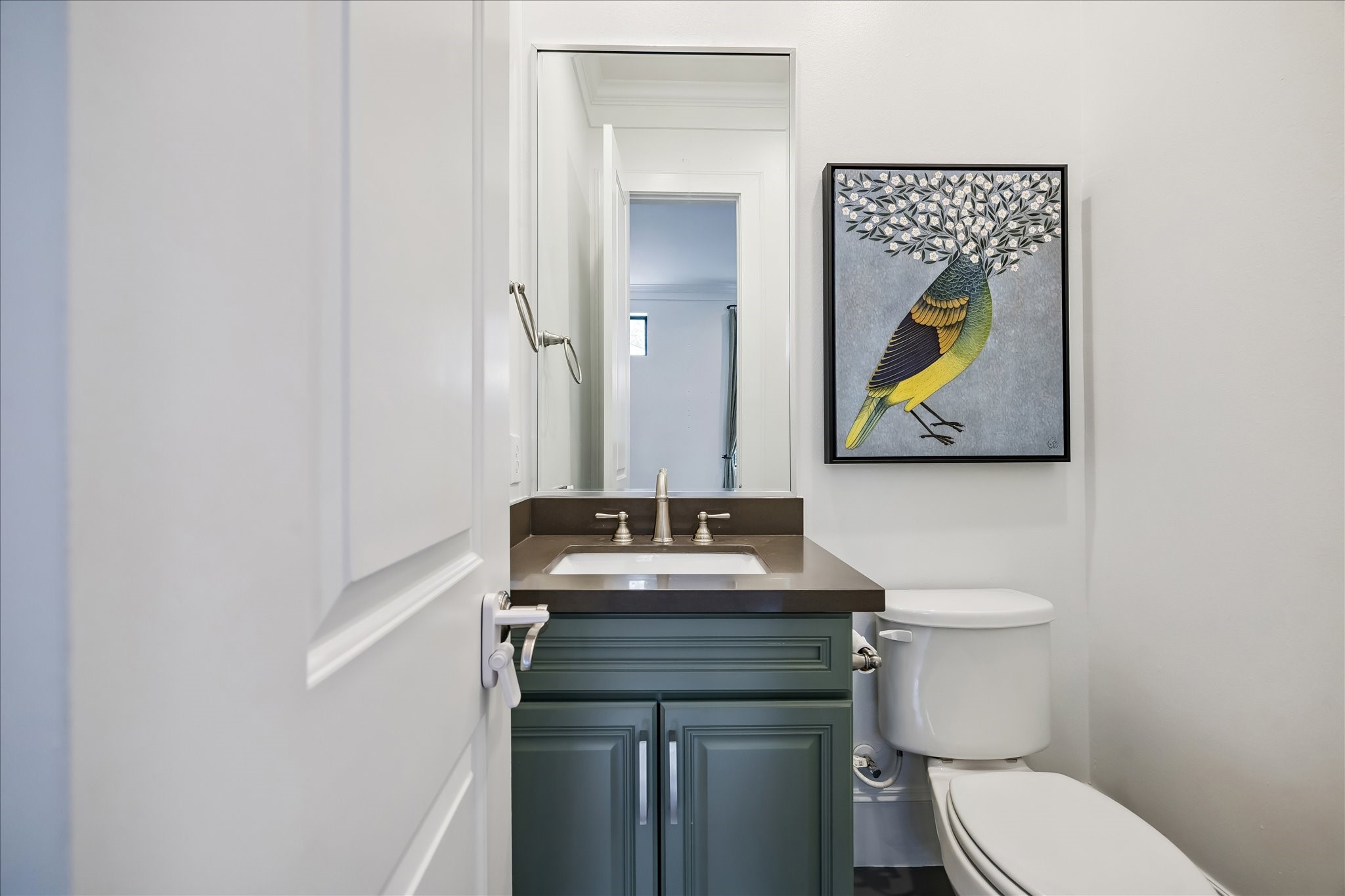 1208 Welch Street Houston, TX 77006 - Photo 14 of 35 The half bath on the first floor is tucked next to the stairs, but not under them, giving a spacious feel for your guests. There's another half bath in the third floor living space.