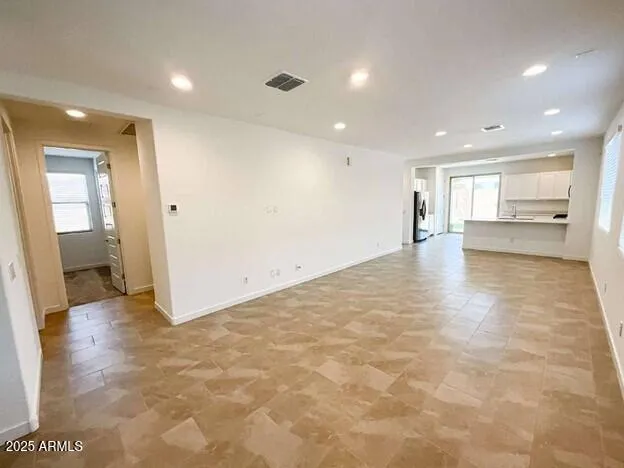 a view of an empty room and a window