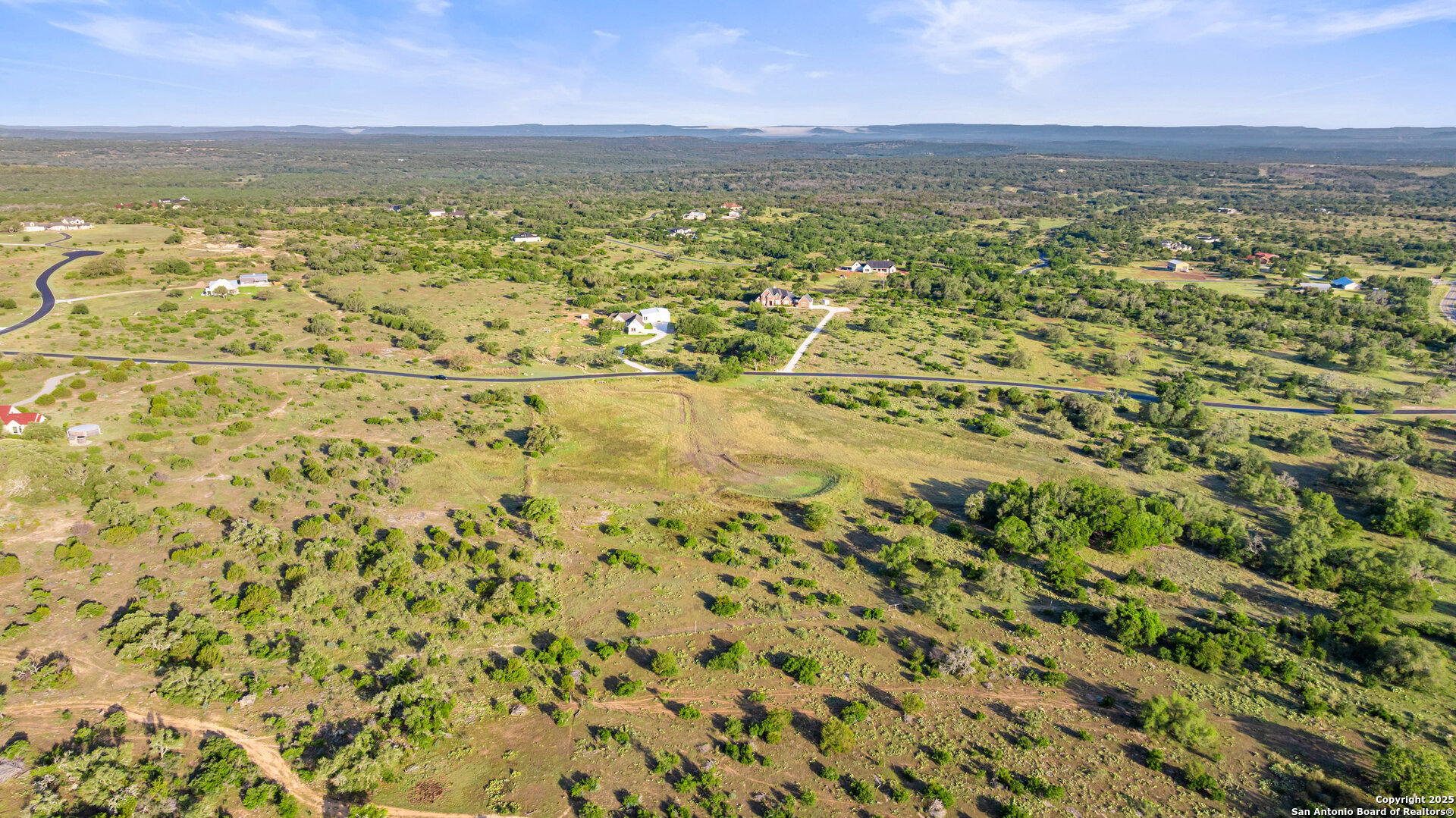 Lot 3 Vista Ridge Round Mountain, TX 78663 - Photo 6 of 19 a view of a city with an ocean beach