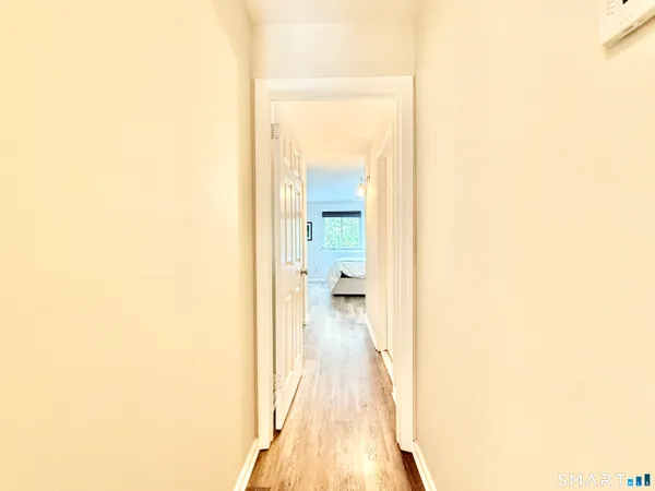a view of a bedroom from a hallway