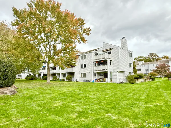 a view of a building with a yard