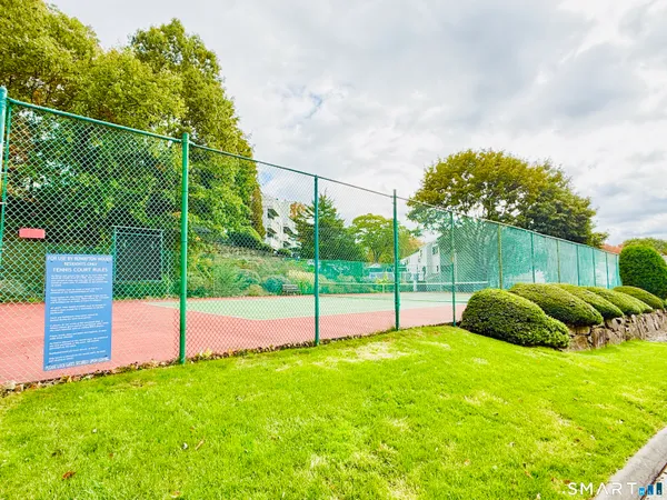 a backyard of a house with plants and outdoor seating