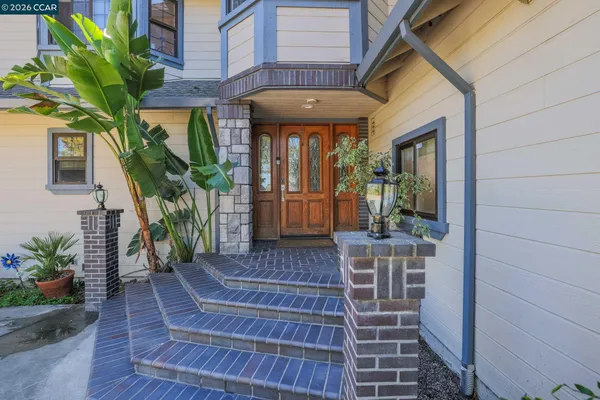 a front view of a house with a porch