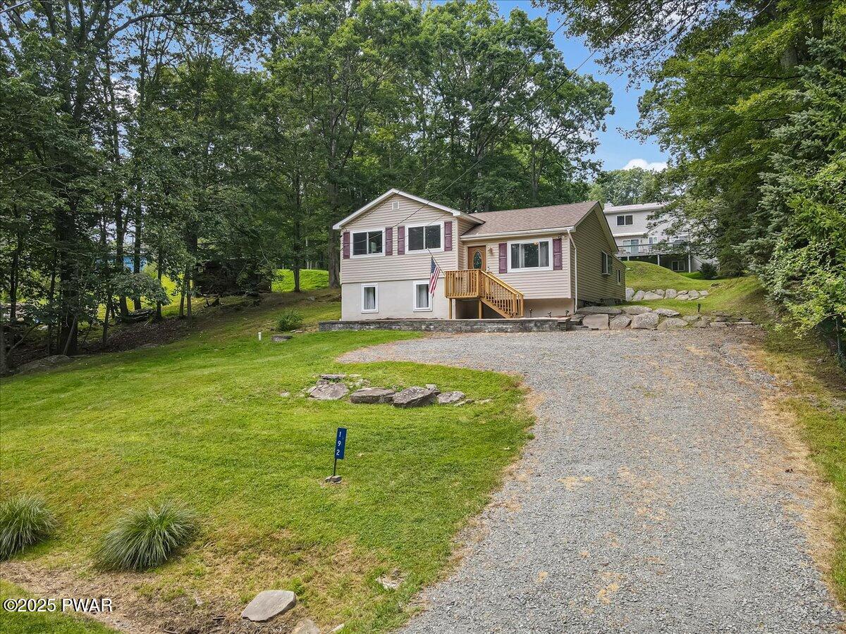 192 Heather Hill Road Dingmans Ferry, PA 18328 - Photo 59 of 74 a house view with a garden space