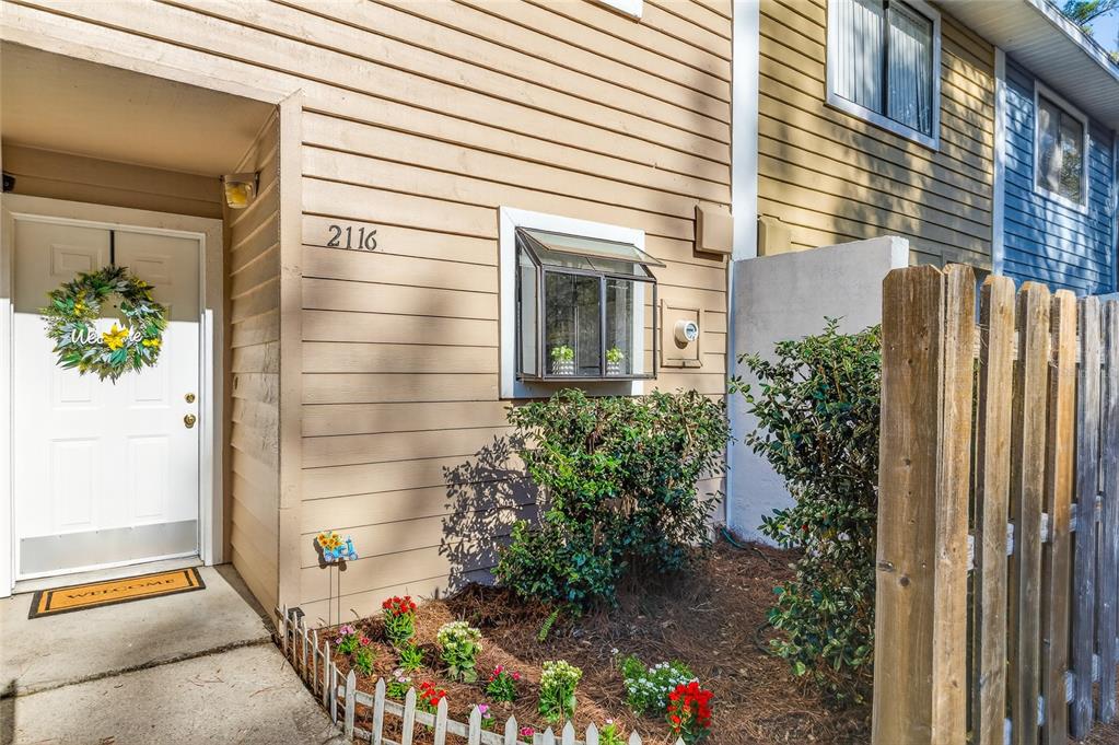 2116 Southwest 39 Drive Gainesville, FL 32607 - Photo 1 of 28 a view of backyard with potted plants