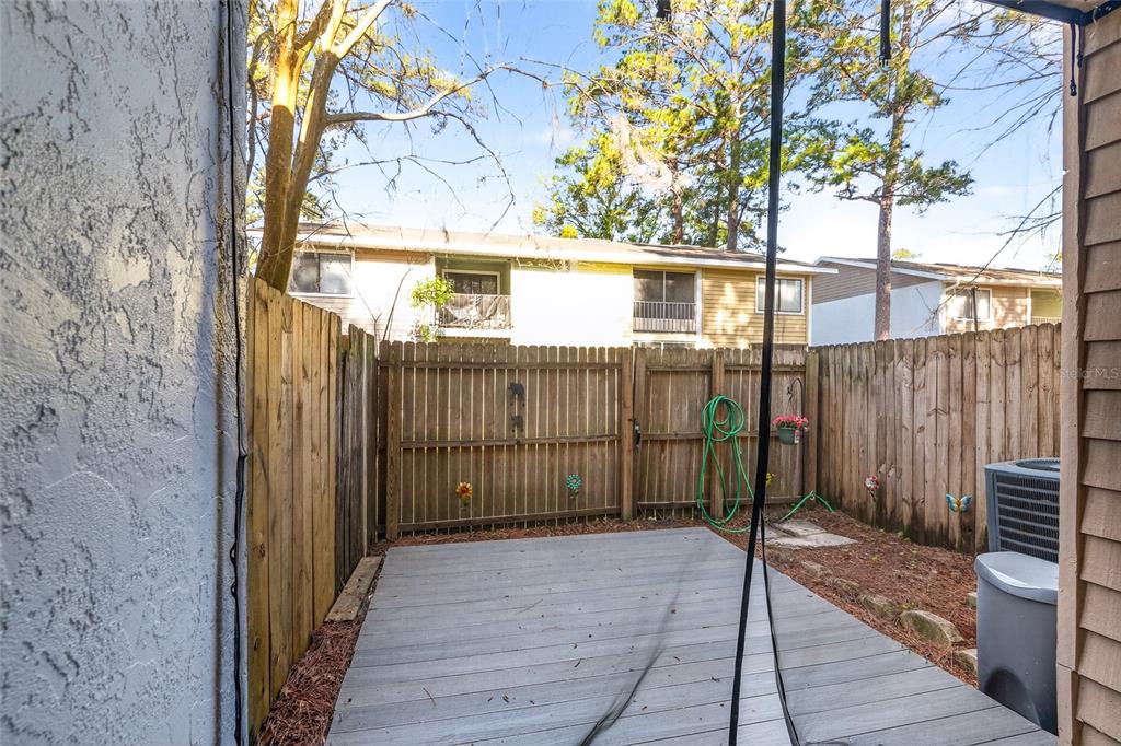 2116 Southwest 39 Drive Gainesville, FL 32607 - Photo 12 of 28 a view of a house with a backyard