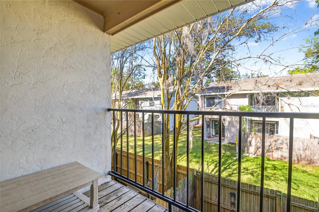 2116 Southwest 39 Drive Gainesville, FL 32607 - Photo 16 of 28 a view of a balcony with wooden floor