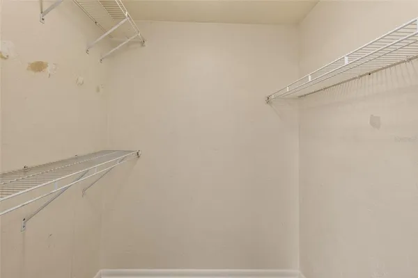 a view of a room with racks on the wall
