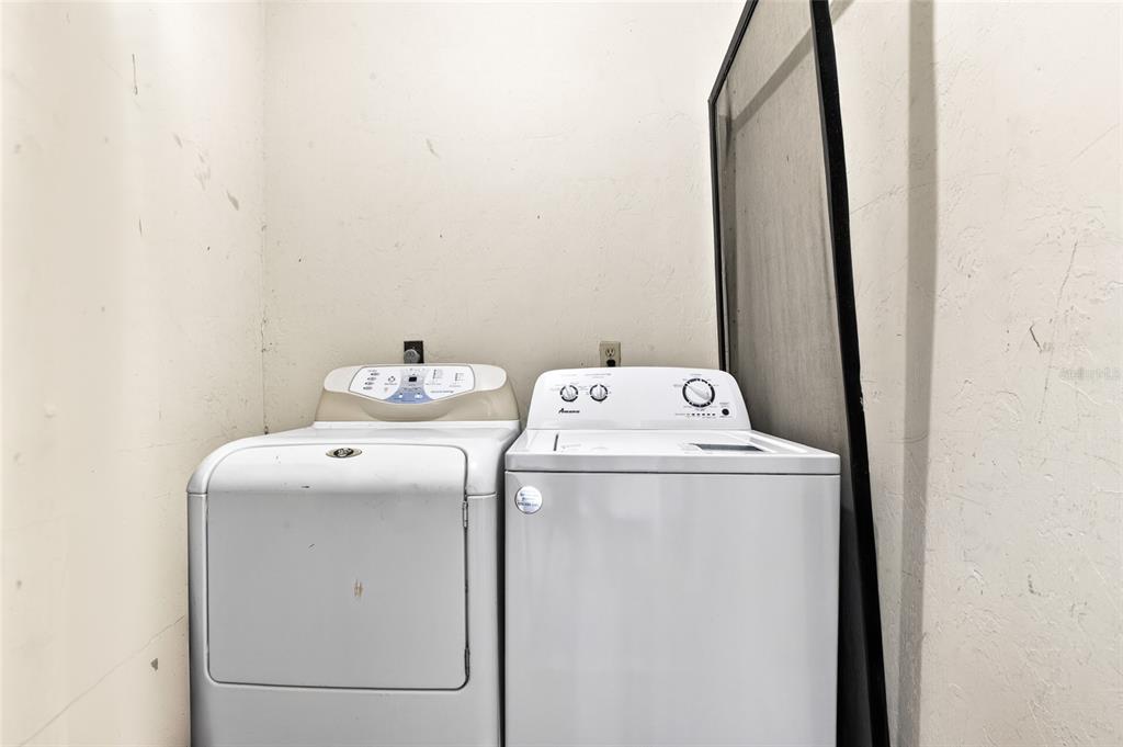 2116 Southwest 39 Drive Gainesville, FL 32607 - Photo 20 of 28 a utility room with dryer and washer