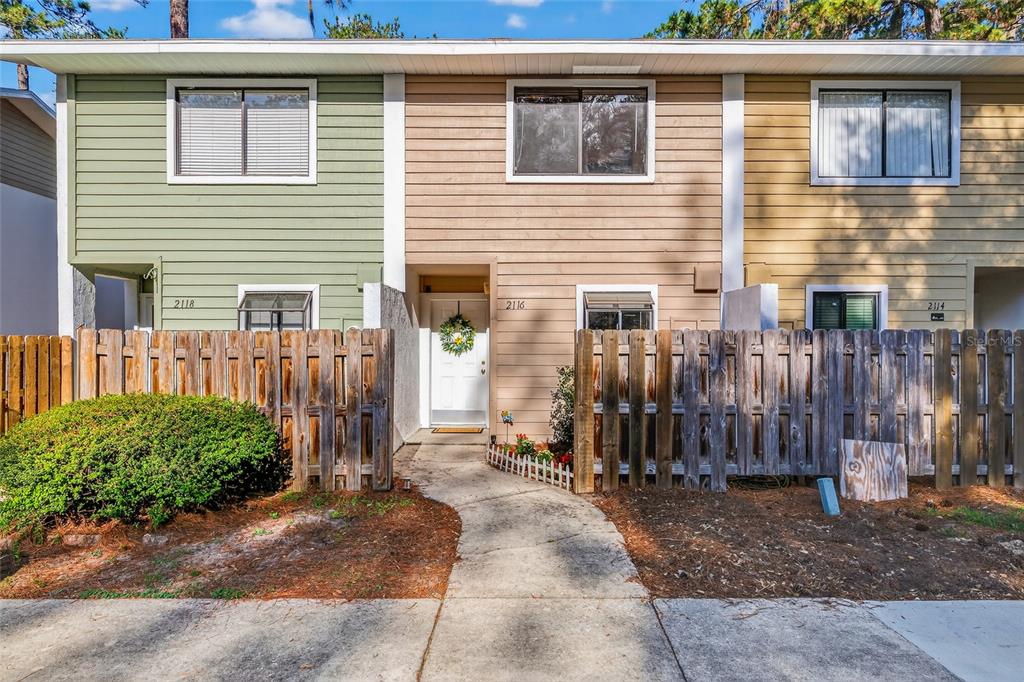 2116 Southwest 39 Drive Gainesville, FL 32607 - Photo 2 of 28 a front view of a house with a porch