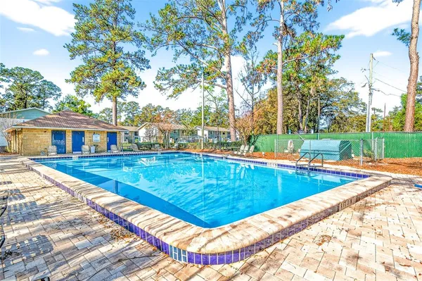 a view of swimming pool with a yard