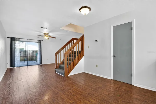 a view of an entryway with wooden floor