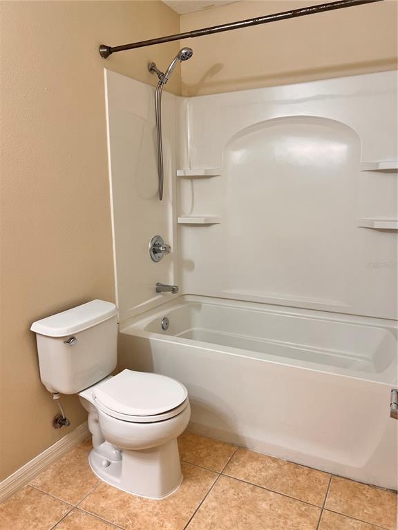 2476 Hassonite Street Kissimmee, FL 34744 - Photo 8 of 8 a bathroom with a toilet and a shower