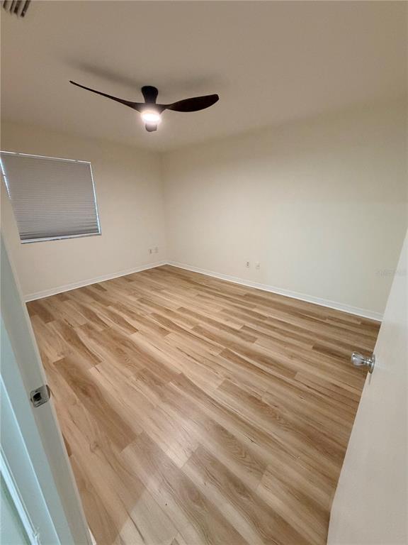 2651 Graduate Court Orlando, FL 32826 - Photo 9 of 13 a view of a room with wooden floor