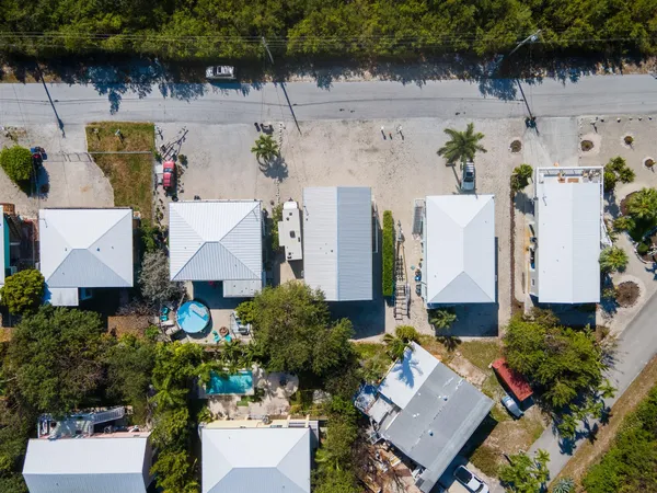 an aerial view of a house with outdoor space