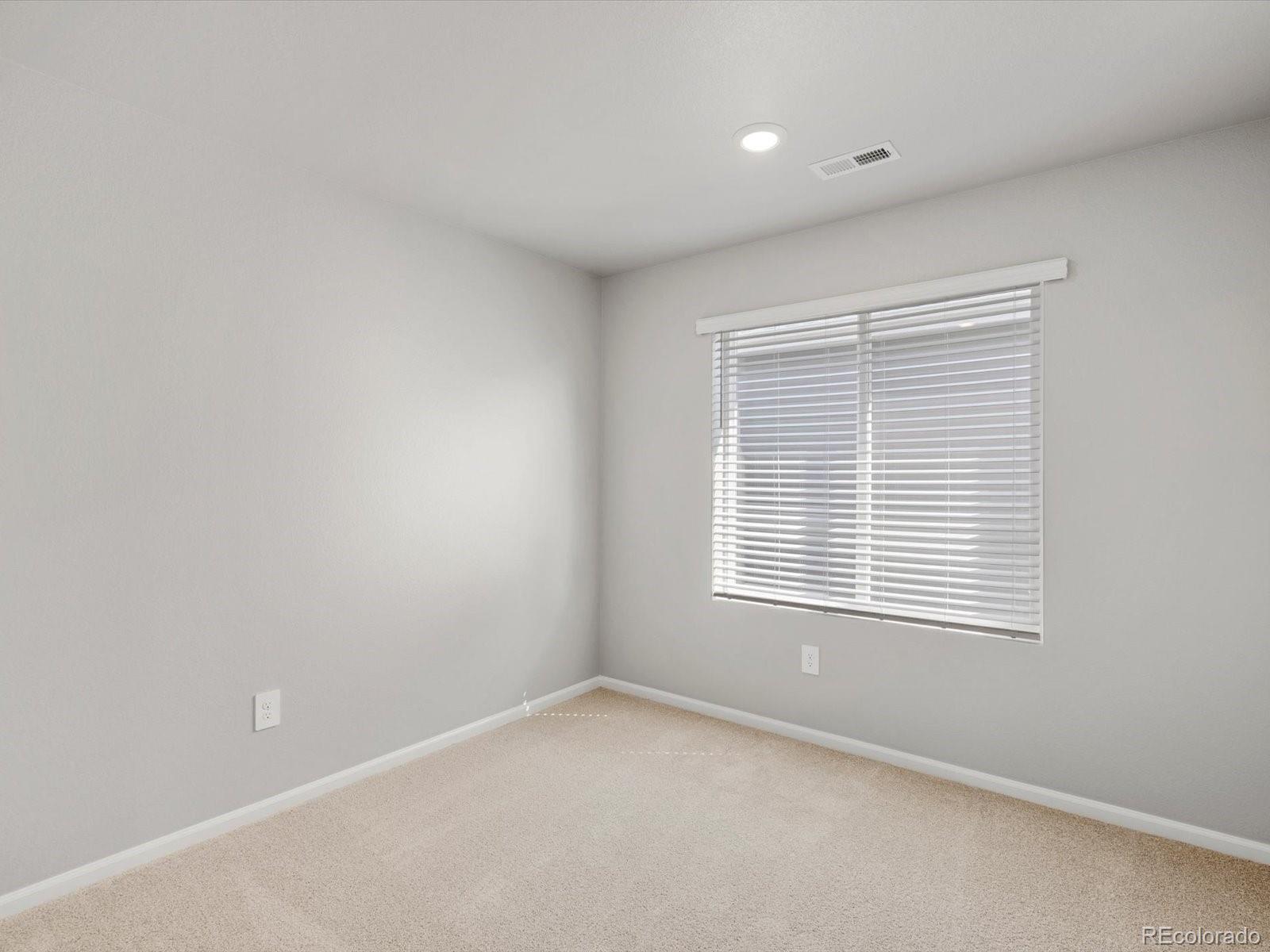 628 98th Avenue Greeley, CO 80634 - Photo 13 of 21 an empty room with a window