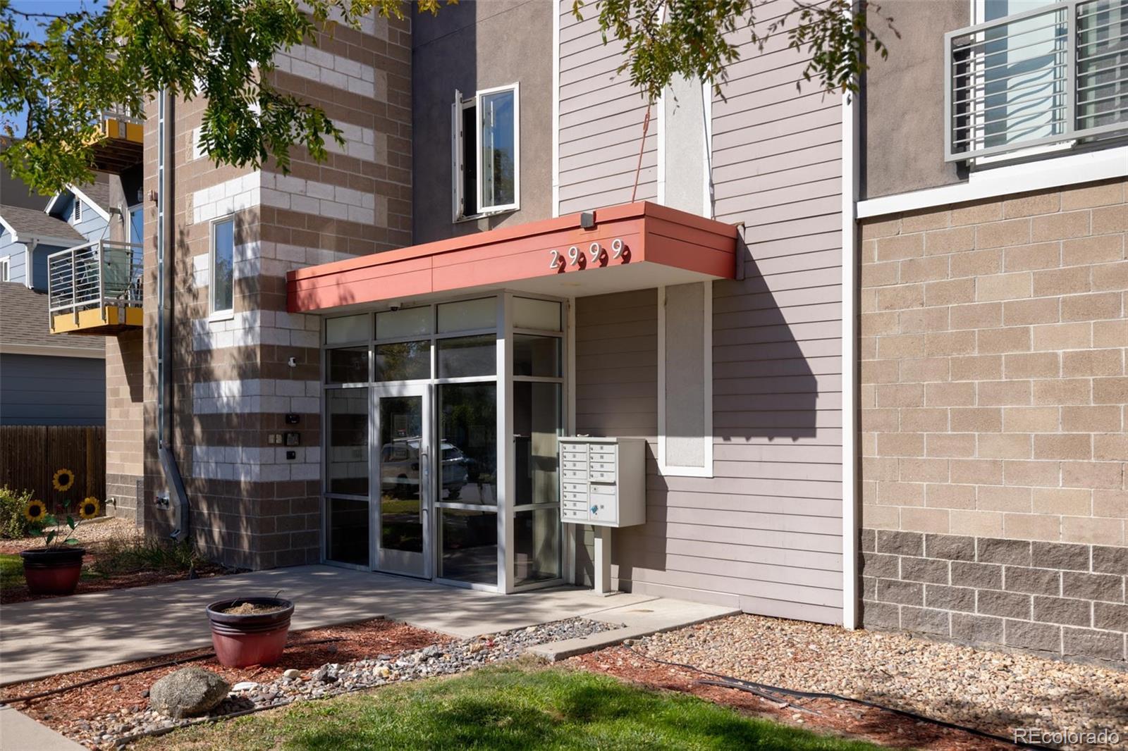 a view of a house with yard and sitting area