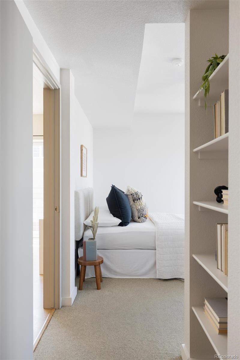 2999 Lawrence Street, Unit 202 Denver, CO 80205 - Photo 22 of 40 a living room with furniture