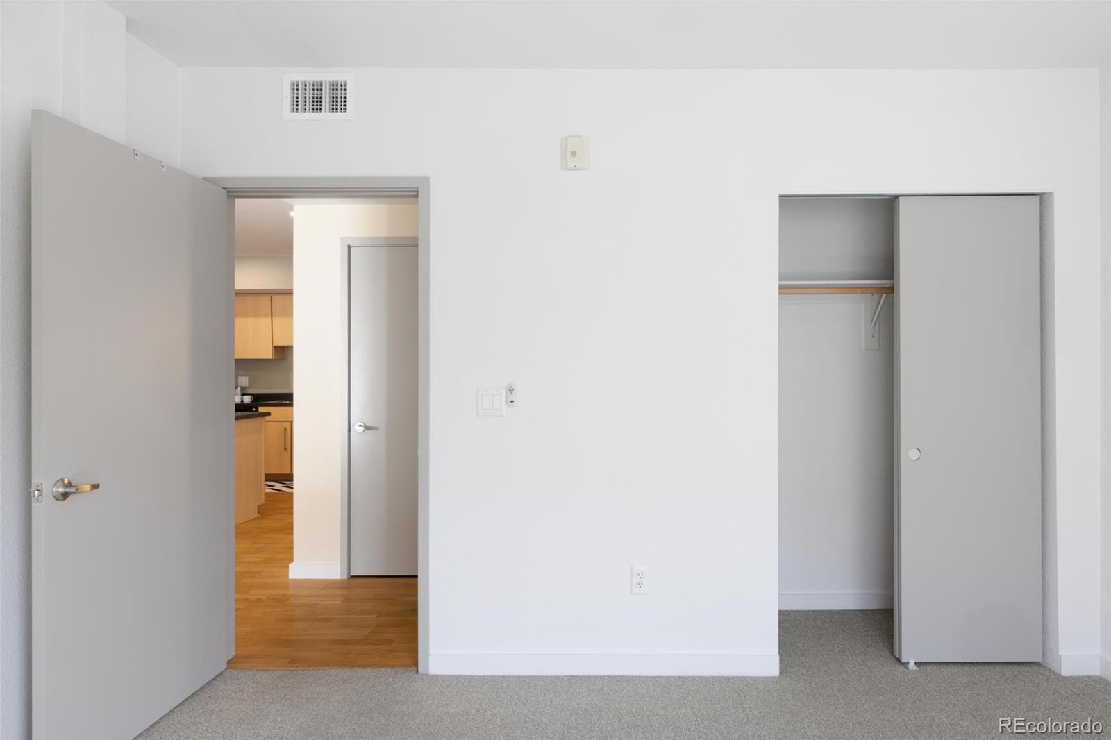 2999 Lawrence Street, Unit 202 Denver, CO 80205 - Photo 24 of 40 a view of an empty room with wooden floor