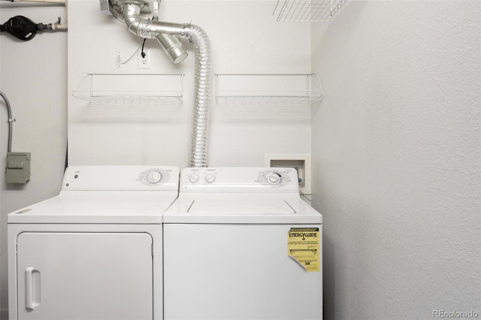 2999 Lawrence Street, Unit 202 Denver, CO 80205 - Photo 28 of 40 a utility room with dryer and washer
