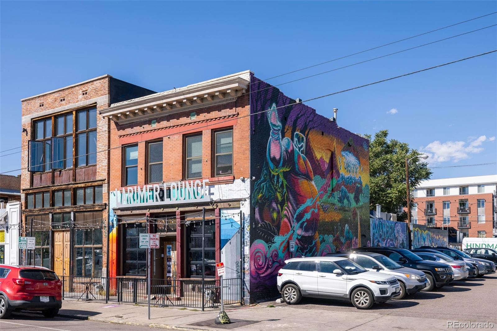 2999 Lawrence Street, Unit 202 Denver, CO 80205 - Photo 36 of 40 a car parked in front of a building