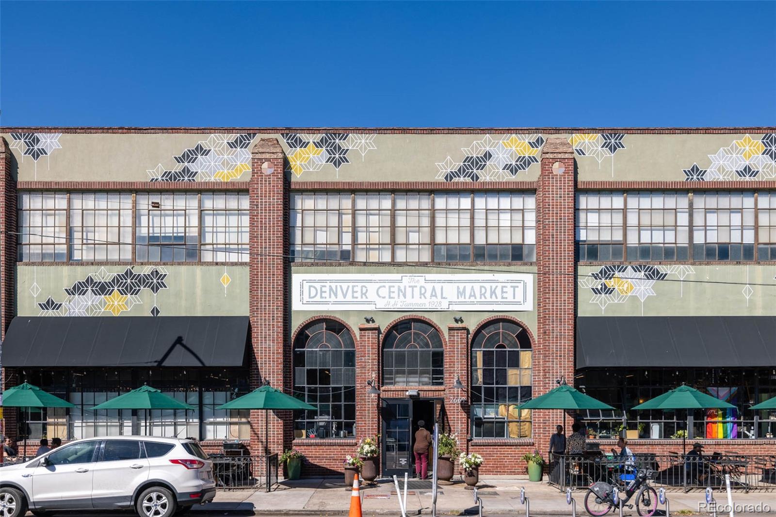 2999 Lawrence Street, Unit 202 Denver, CO 80205 - Photo 37 of 40 a group of cars parked in front of building